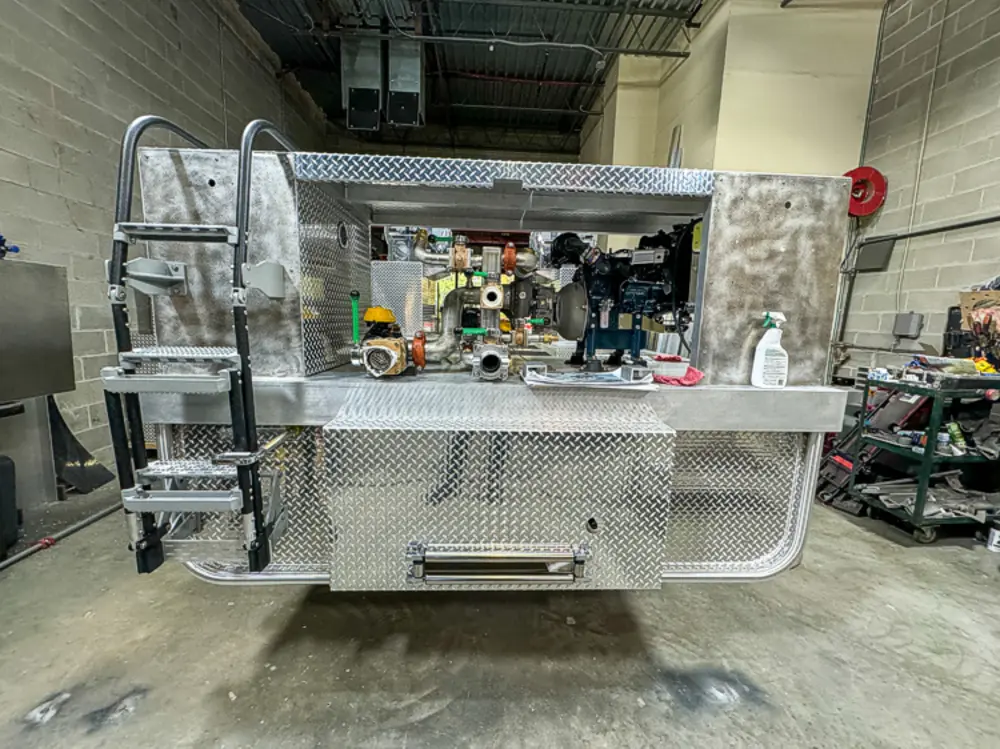 Apparatus in production bay with hood open, photo 141 of 303.